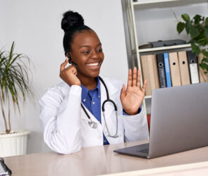 African female doctor talk to patient by telemedicine online webcam video call.