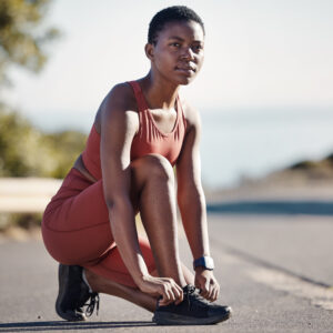 Lace shoes, fitness and black woman woman on street for workout, running and wellness in Nigeria. R